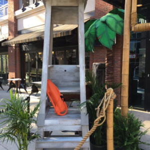 A Beach Guard Shack on a sidewalk.