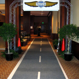 A walkway leading to a room with a sign lined with Street Props.