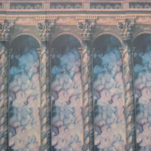 An Art Deco Backdrop of columns and clouds on a wall.