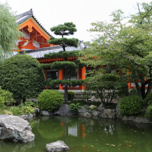 A Koi Garden Backdrop with a pond and rocks.