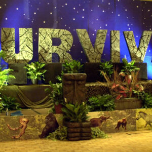 A jungle themed party with African Stage Sets and Entrances that says survival.