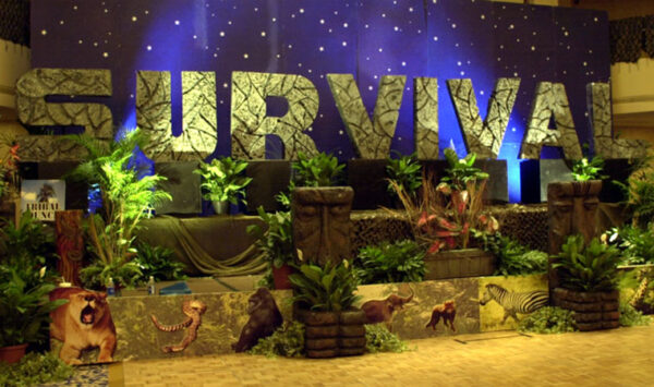 A jungle themed party with African Stage Sets and Entrances that says survival.