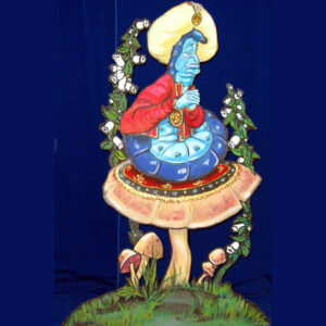 A statue of The Caterpillar sitting on top of a mushroom.