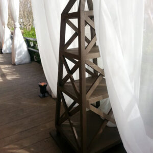 A wooden structure for corporate event rentals on a wooden deck.