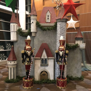 Two nutcrackers in front of a Winter Castle.