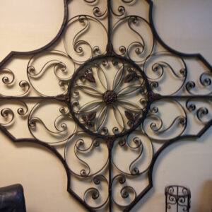 A large wrought iron wall hanging in a room available for Corporate Event Rentals.