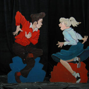 Two Fabulous Fifties wooden sculptures of a man and a woman dancing.