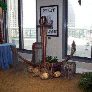 A Sailing Ship on a table in front of a window.