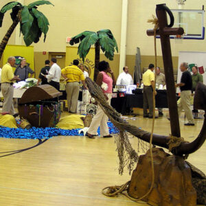 A group of people standing in a Treasure Chest Vignette.