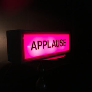 A pink Applause Sign.