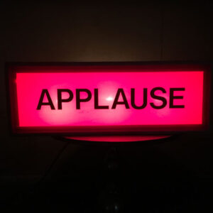 A red led sign with the Applause Sign on it.