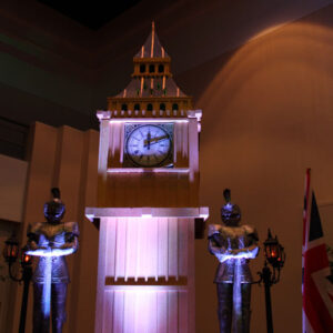 Big Ben is a clock tower with two statues on top of it.