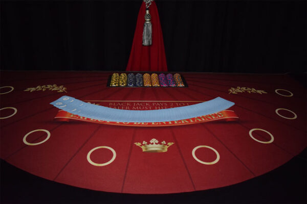 An image of a Blackjack table with a crown on it.