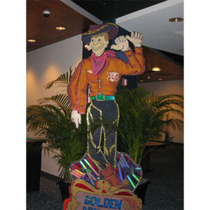 A wooden statue of Cowboy Flats.