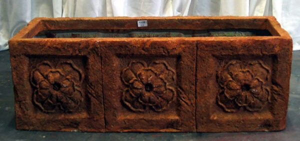 A large Decorative Planters on a table.