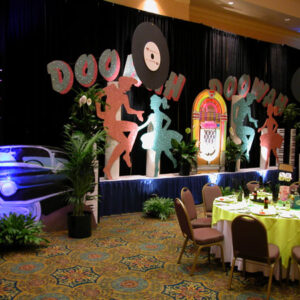 A Doo Wah Stage and Table Set set up for a party.