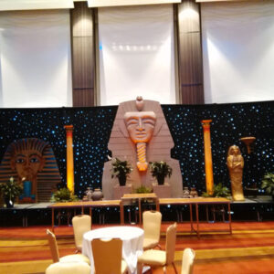 An Egyptian themed party with a large pharaoh statue and Cargo Boxes.