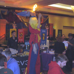 A man standing on Fire Eater stilts.