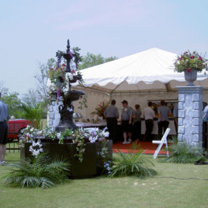 A white Savannah Garden in the middle of a grassy area.