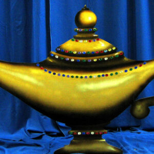 A Genie Lamp Flat on a blue curtain.