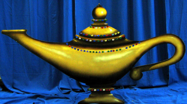 A Genie Lamp Flat on a blue curtain.