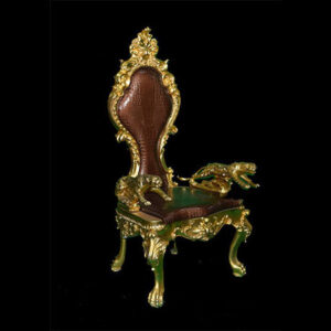 An ornate Baby Throne chair on a black background.