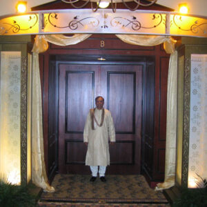 A man standing in front of a door.