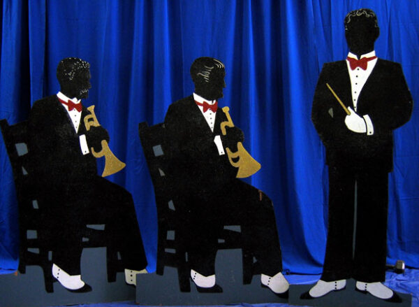 Three men in Character Flats sitting on chairs.