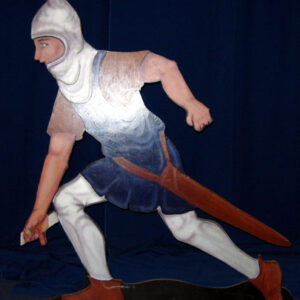 A Fire Eater wooden statue of a man running with a sword.