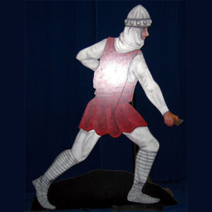 A wooden figure of a Fire Eater holding a sword.