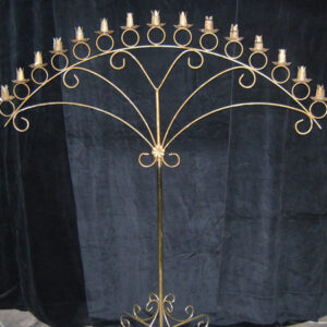 A large wrought iron candelabra on a stand.