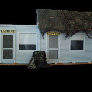 A model of a Latrine and Shower Block Facade with a camouflage roof.