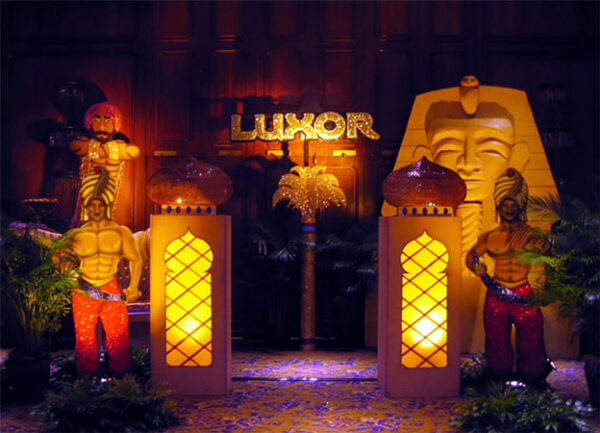 A group of Luxor Entrance statues in a room.