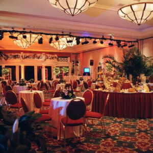 A large ballroom with tables and chairs became a Pallet Wood Wall.