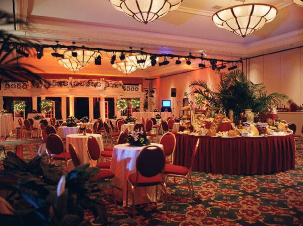 A large ballroom with tables and chairs became a Pallet Wood Wall.