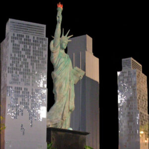 A Mock Buildings in front of tall buildings.