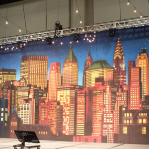 A New York Stage Set with a cityscape backdrop.