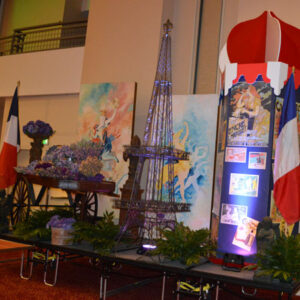 A display of flags and a Paris Collection.