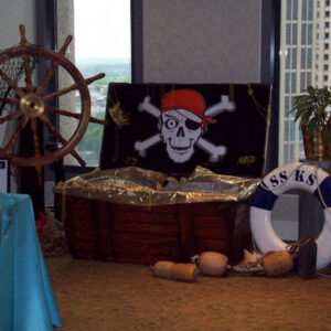 A room with a pirate theme and a sailing ship.