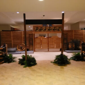 The Ranch Entrance to a lobby with wooden fences and a wooden wagon.