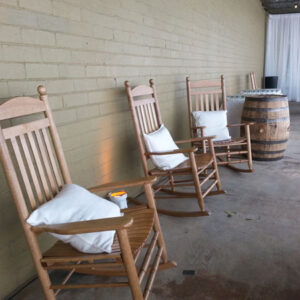 Three Pallet Wood Walls are lined up next to a barrel.