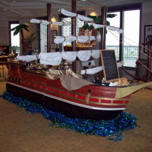 A Sailing Ship on a table in a room.