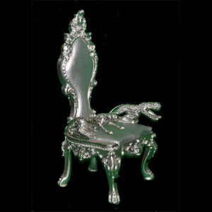 An ornate Baby Throne on a black background.