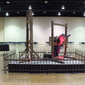 A large room with a display of the Guillotine.