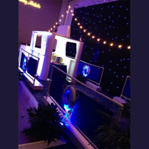 A Tug Boat Set with blue lights and a blue tablecloth.