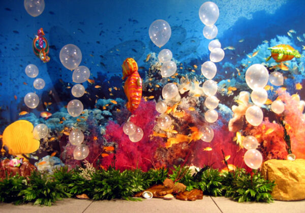 An underwater themed party with balloons and Ocean Backdrops.