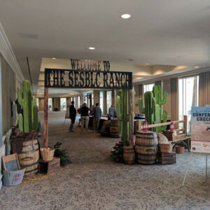 A hallway with Western Entrance Sets and a sign that says welcome to the cactus farm.