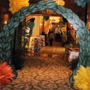 A Wonderland Entrance decorated with flowers.