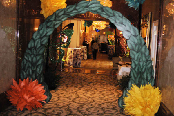 A Wonderland Entrance decorated with flowers.