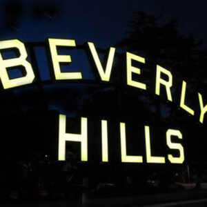 The Beverly Hills Sign is lit up at night.